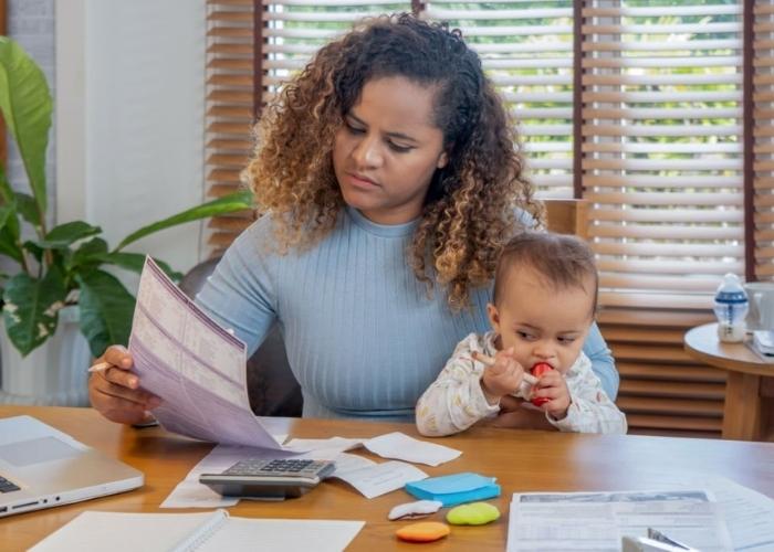 single mother working on her application for tax deduction
